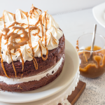 Meringue Topped Chocolate Fudge Cake with Salted Caramel Sauce | Annie's Noms - This is no ordinary chocolate fudge cake, it's a showstopper! A rich, soft cake is perfectly complimented by sweet, glossy peaks of meringue and drizzled with homemade sticky, salted caramel sauce. Chocolatey and with that perfect contrast between sweet and salty, what is there not to love?