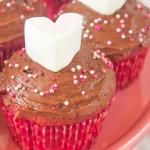 These Pink Velvet Cupcakes are not quite chocolate and not quite vanilla, but they are absolutely delicious! Soft, tender and topped with a rich, melted chocolate frosting; these are the perfect, simple dessert to make for your Valentine!