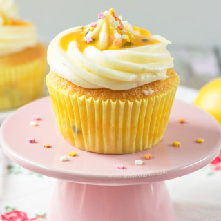 These Lemon and Passion Fruit Cupcakes are light, delicate and pack a real flavour punch. Tender lemon cupcakes, with Passion Fruit Coulis inside the cake and on top of the frosting - these are the perfect cupcakes to welcome Spring!