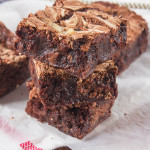 These Marshmallow Swirl Creme Egg Brownies are too decadent for words! Super fudgy brownies, packed with smashed Creme Eggs and swirled with sweet, sticky Marshmallow Fluff - a chocolate filled treat for Easter!