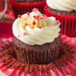 A soft, rich chocolate and peppermint cupcake is topped with smooth, peppermint frosting and finished off with crushed candy canes, creating a fun, festive cupcake!