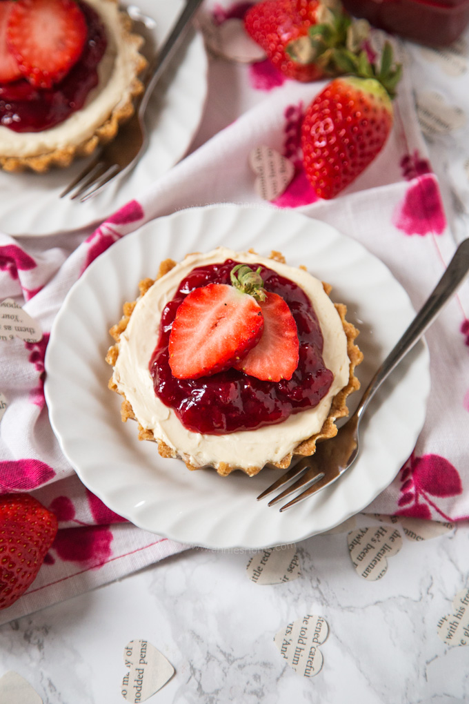 Delightfully creamy and sweet no bake Strawberry Cheesecakes individually portioned and perfect for a Valentine's Day dessert!