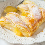 This Lemon Cream Cheese braid is ready in under 30 minutes! Flaky pastry filled with lemon curd and cream cheese to create a sweet, yet tart dessert everyone will love!