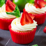 These Strawberry Pimms cupcakes are Wimbledon in cupcake form! Lemon and lime cupcakes with a pimms syrup and frosting. Sweet, light and so refreshing! #ad #wimbledon2017