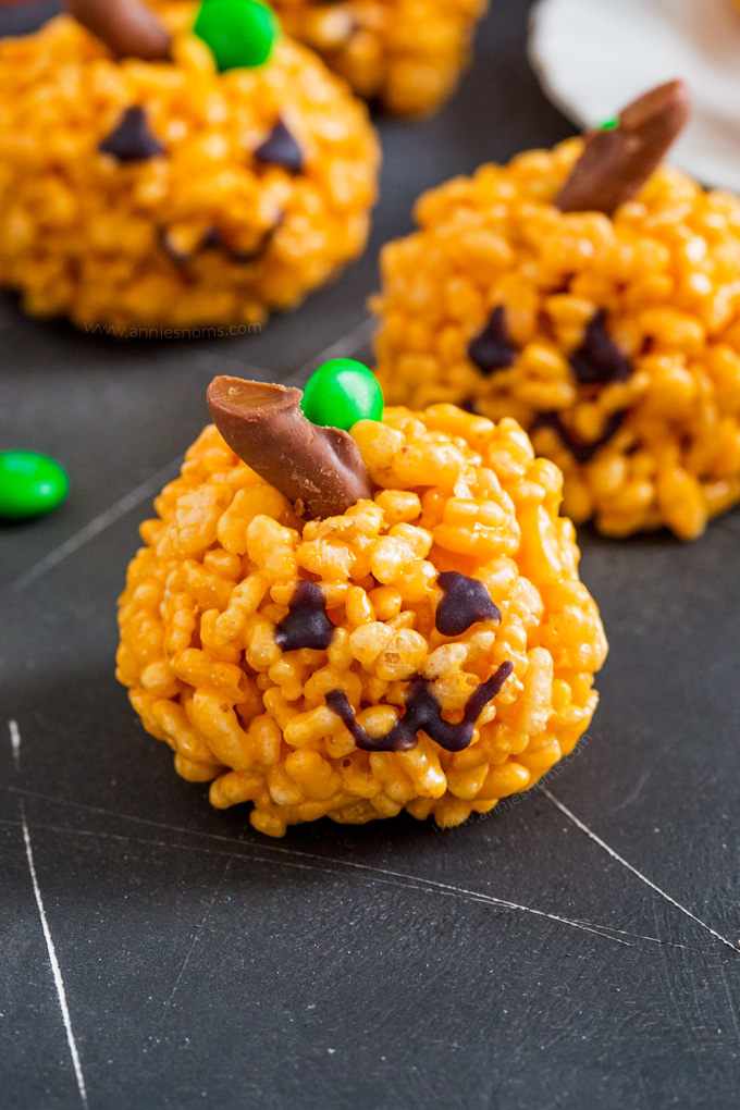 These cute little Pumpkin Rice Krispie Treats are kid friendly and so easy to make! The perfect little Halloween treats for adults and kids alike!