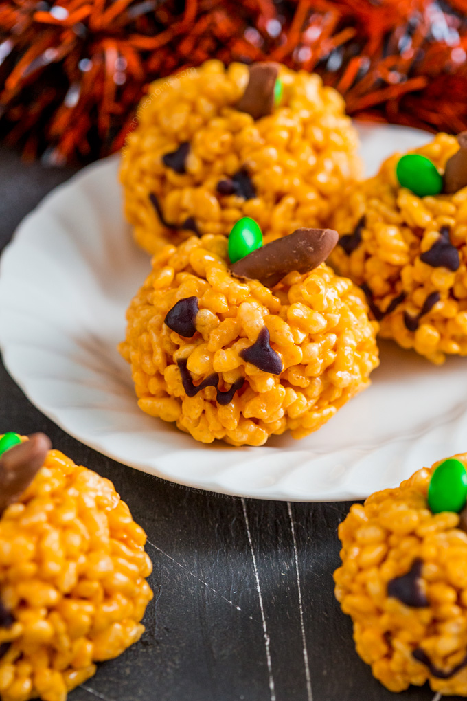These cute little Pumpkin Rice Krispie Treats are kid friendly and so easy to make! The perfect little Halloween treats for adults and kids alike!