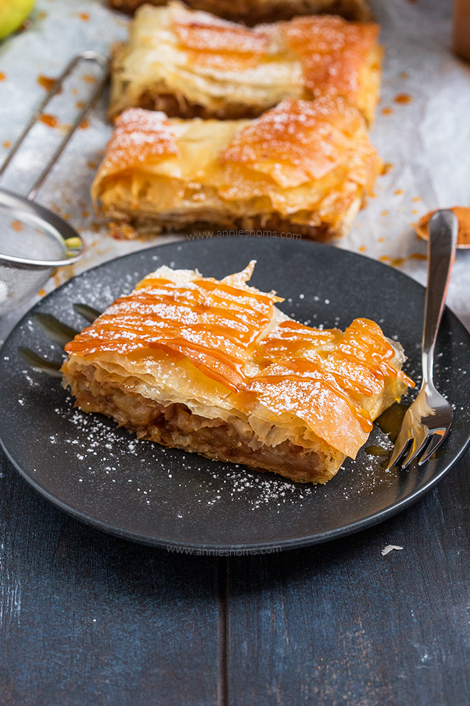 This quick and easy Apple Strudel is made with sheets of ready made filo pastry and filled with a spicy, sweet apple mixture. From prep to table in under an hour, this is perfect for feeding a crowd!