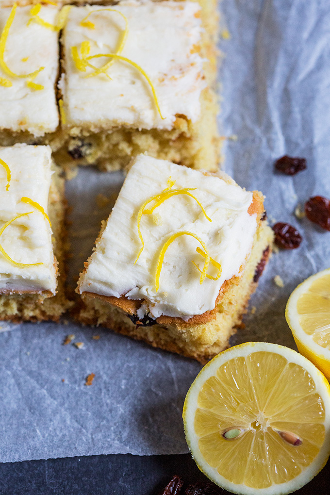 These light and soft Lemon and Cranberry Cake Bars are filled with lemon zest and juicy cranberries. They are simple to make and feed a crowd! ﻿