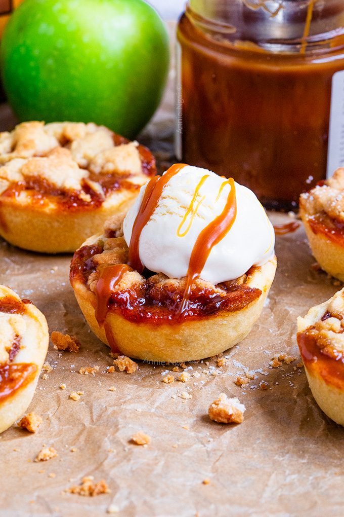 These Mini Toffee Apple Crumble Pies make pie making easy! Made in a muffin tin with buttery pastry, tender apples, toffee sauce and a buttery crumble topping. They are Autumn in dessert form!