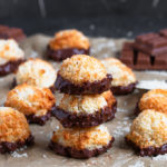 These Coconut Macaroons are ridiculously easy to make and only need a few ingredients! Baked until golden and dipped in chocolate, they're the perfect bitesize treat!
