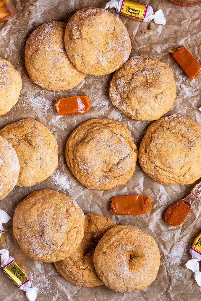 These soft and chewy Caramel Stuffed Pumpkin Snickerdoodles are Autumn in cookie form! A caramel centre meets a Pumpkin cookie rolled in cinnamon sugar and baked to perfection!